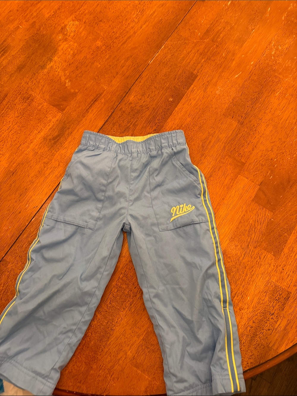 Nike Kids Blue Joggers with Yellow Side Stripes